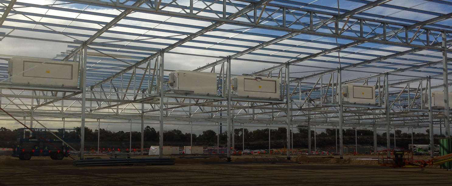 construction site with steel frame with five cabinet coolers established