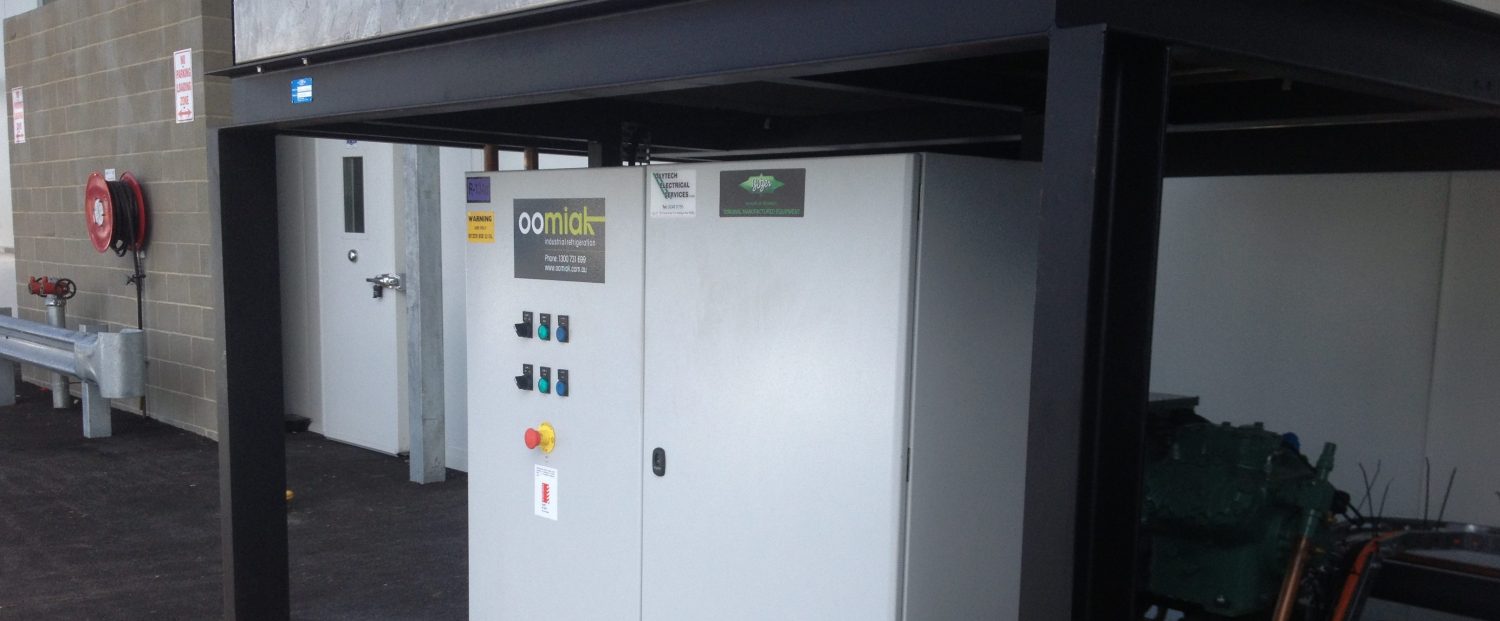 equipment under shelter outside with an oomiak logo on it