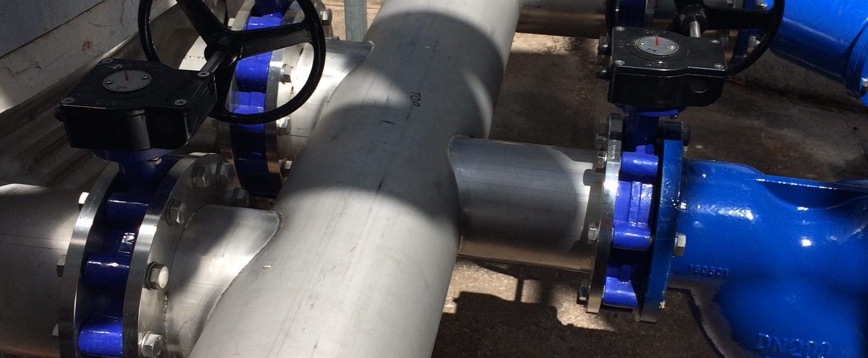 close shot of valves and pipework in an industrial refrigeration site