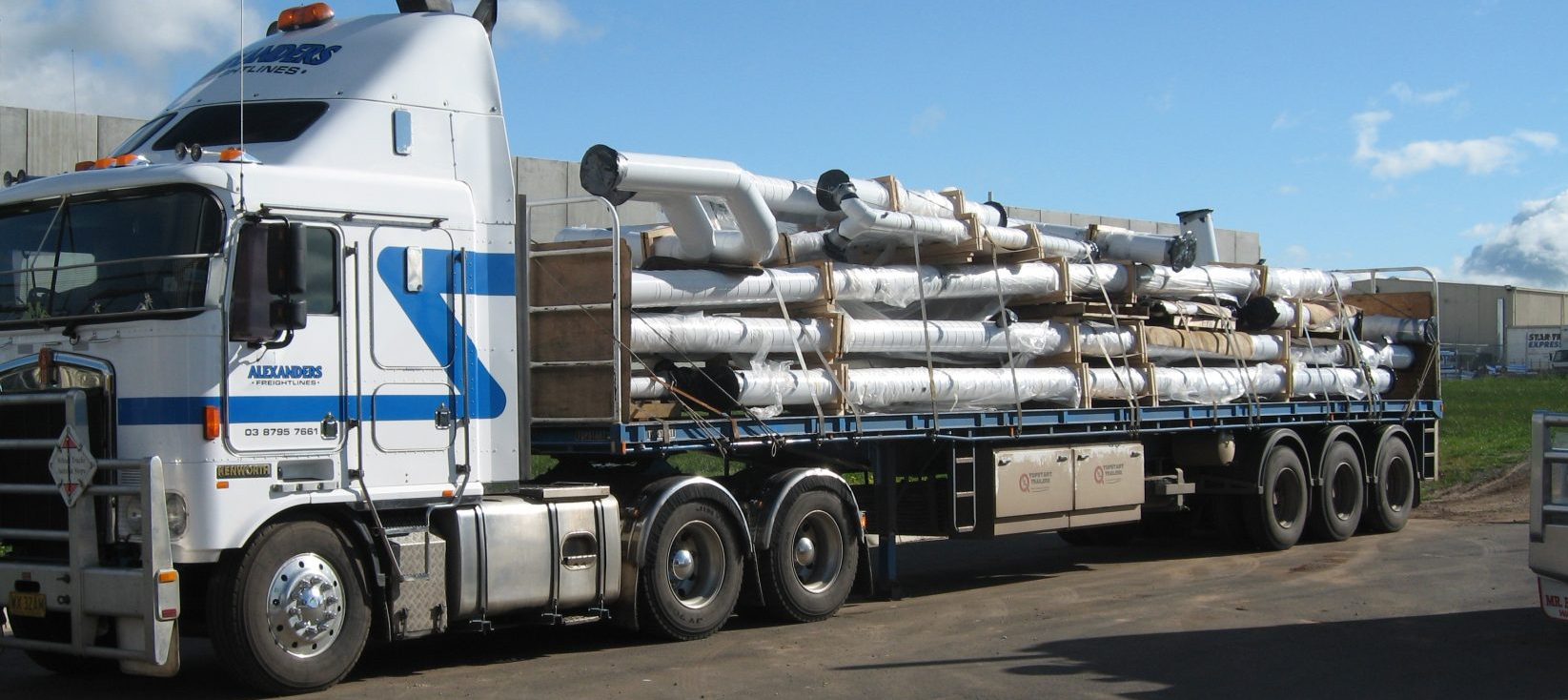 truck with multiple pipes on it