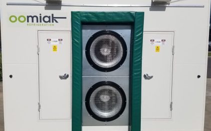 an oomiak fast cooler outside on concrete pavement