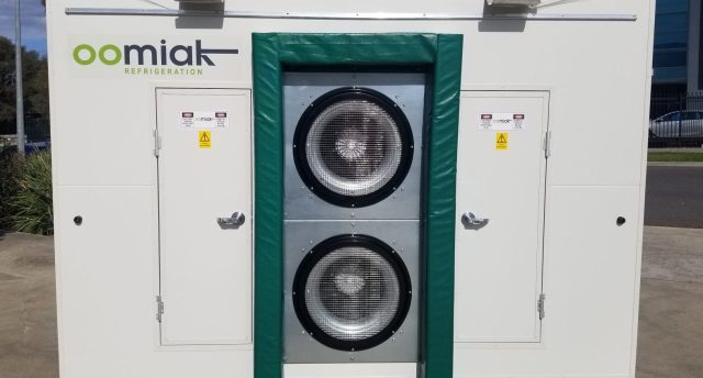 an oomiak fast cooler outside on concrete pavement