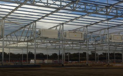 construction site with steel frame with five cabinet coolers established