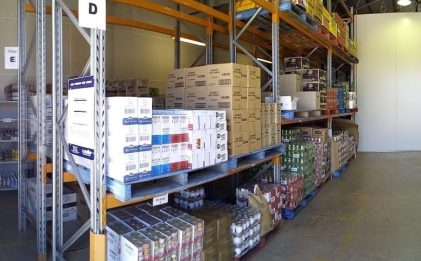 a cool room with racking and boxes inside
