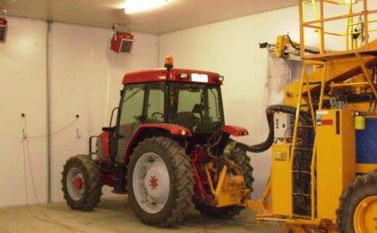 tractor and other harvesting machinery in a shed