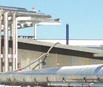 outdoor piping at an industrial refrigeration food processing facility