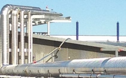 outdoor piping at an industrial refrigeration food processing facility