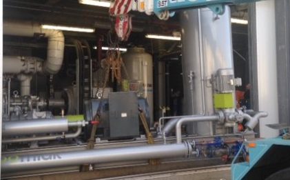 crane lowering an industrial refrigeration compressor package