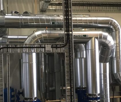 industrial refrigeration plantroom with multiple pieces of equipment