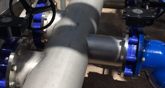 close shot of valves and pipework in an industrial refrigeration site