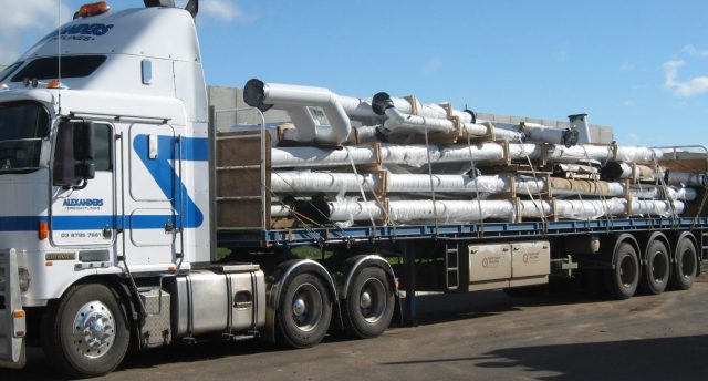 truck with multiple pipes on it