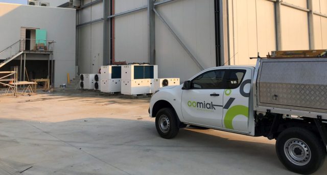 oomiak branded vehicle parked outside a distribution centre