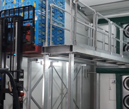 forklift moving pallets with filled with boxes in a ripening room