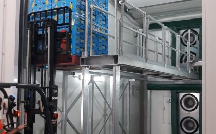 forklift moving pallets with filled with boxes in a ripening room