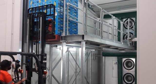 forklift moving pallets with filled with boxes in a ripening room