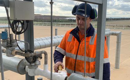 man wearing high vis workwear and ear personal protective equipment outdoors