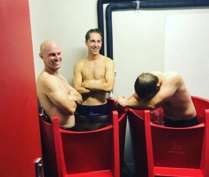 two ice baths with three men in them