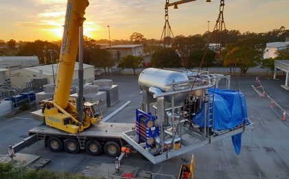 crane carrying an r22 chiller system for arnott’s biscuits