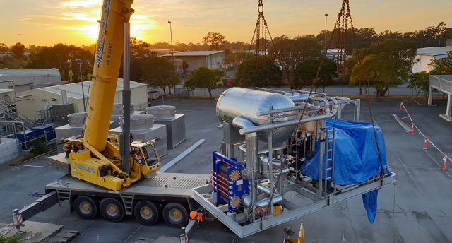 crane carrying an r22 chiller system for arnott’s biscuits