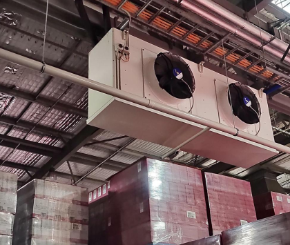 industrial refrigeration equipment hanging from the ceiling of a cool room