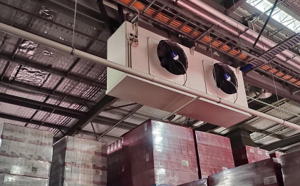 industrial refrigeration equipment hanging from the ceiling of a cool room