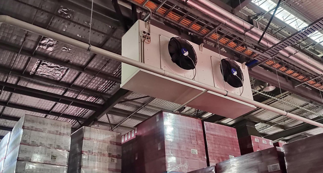 industrial refrigeration equipment hanging from the ceiling of a cool room