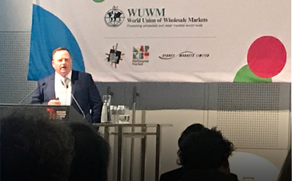man giving a speech to a group of people